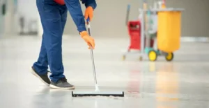 Image of a man cleaning the floor