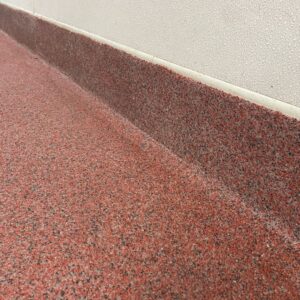 Close-up of epoxy floor and baseboard