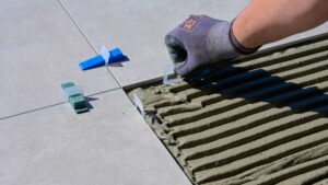 a person installing grout